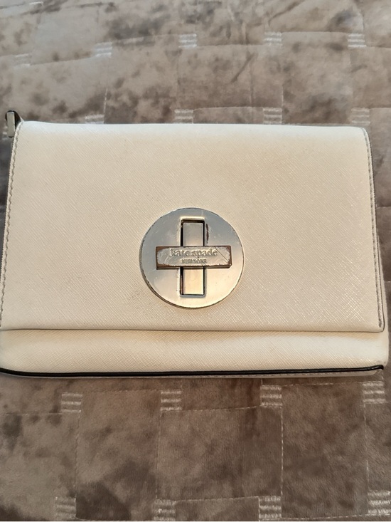 kate spade Handbags - kate spade cream crossbody with gold circular turn-lock